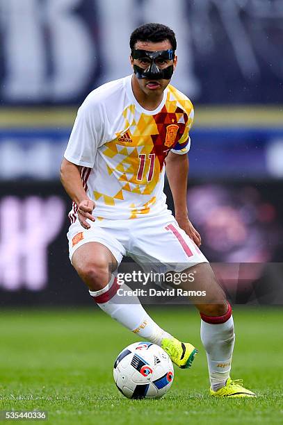 Pedro Rodriguez of Spain runs with the ball during an international friendly match between Spain and Bosnia at the AFG Arena on May 29, 2016 in St...