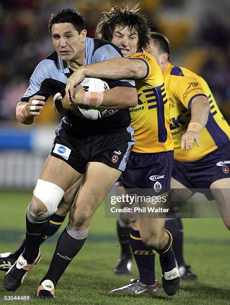 Warriors Steve Price is tackled by Parramatta Eels Nathan Hindmarsh in their NRL Rugby League game at Ericsson Stadium in Auckland, New Zealand,...