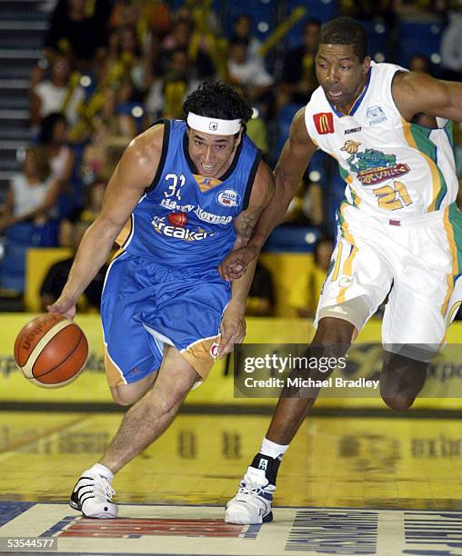 Breakers Paul Henare in action against Croc's Robert Rose during the NBL basketball match between the Breakers and the Townsville Crocodiles played...