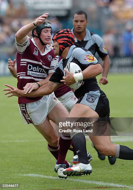 Steve Menzies puts in a tackle on Richard Villasanti during the Manly Sea Eagles 2620 win over the New Zealand Warriors in their NRL rugby legue...