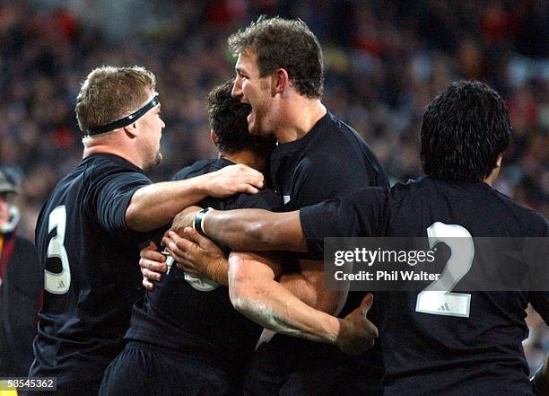 All Black Chris Jack hugs Dan Carter after scoring his try against the British and Irish Lions in the 2nd rugby union match played at the Westpac...
