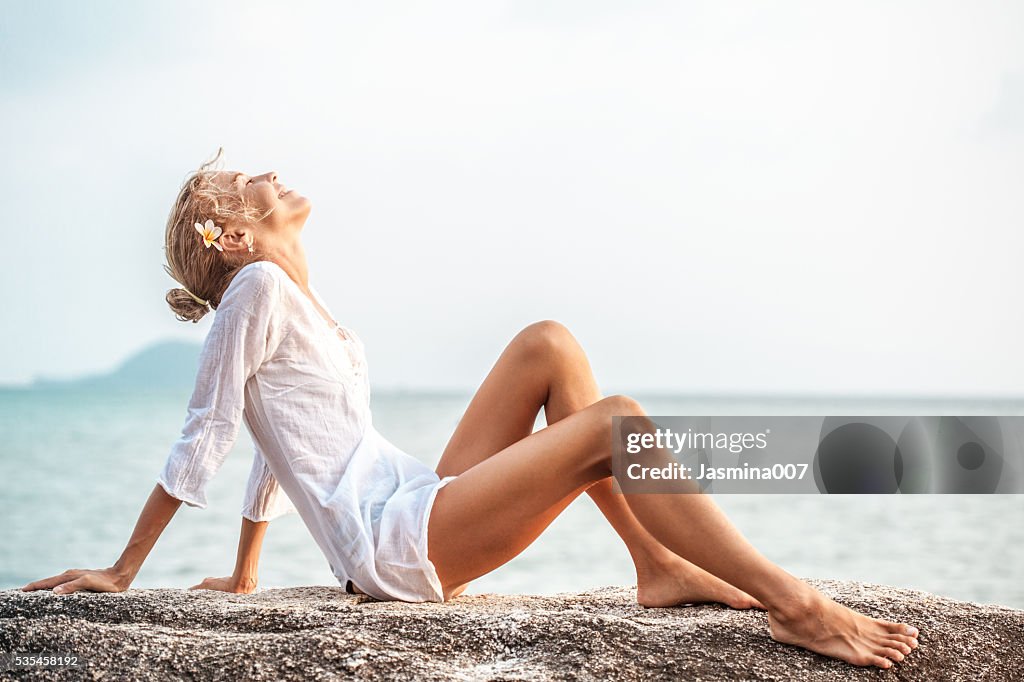 Beautiful young woman  enjoying the beach