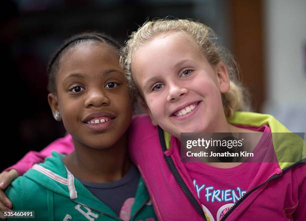 fifth grade girls smile together - hazel bond fotografías e imágenes de stock