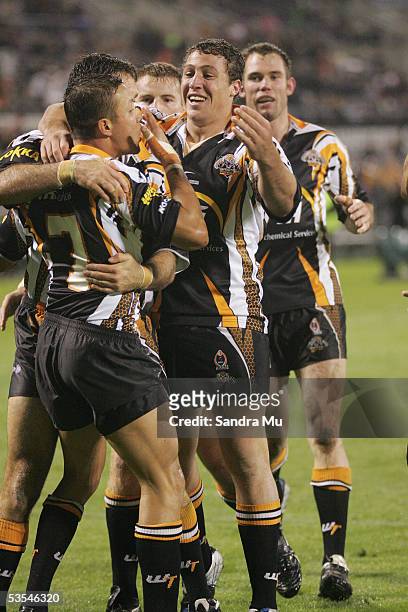 Bryce Gibbs comes in to celebrate number 7, Scott Prince's try during the NRL Rugby League Round 05 match between New Zealand Warriors and West...