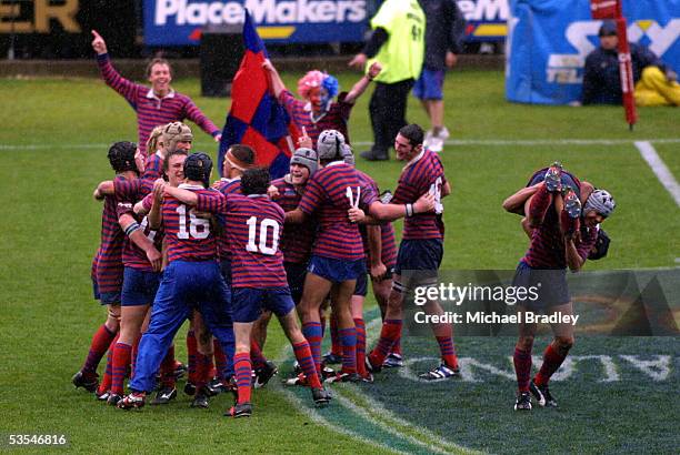 The members of the Rosmini College celebrate their win over Massey High School in the curtain raiser played at Albany.