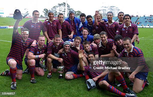The members of the Rosmini College rugby team celebrate their win over Massey High School in the curtain raiser played at Albany.