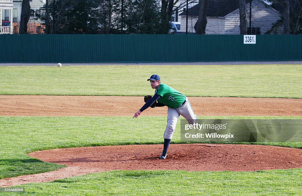 Left Handed High School Baseball Pitcher Throwing Pitch