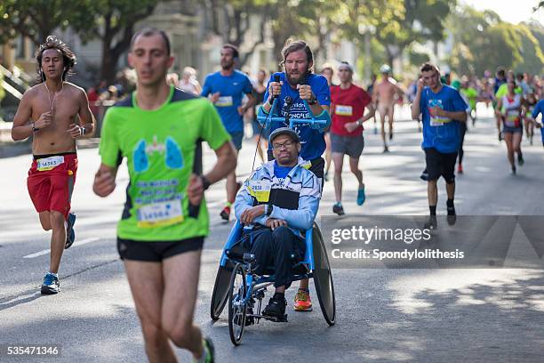 san francisco bay to breakers 2016 event - disabled runner stock pictures, royalty-free photos & images