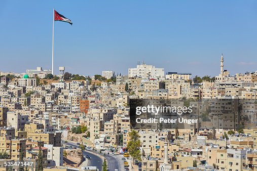 Jordan flag flying on Large Flag pole in Amman Jordan flag flying on Large Flag pole in Amman