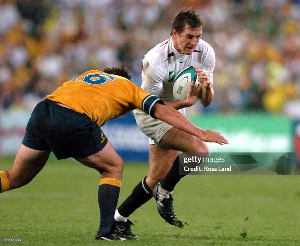 Will Greenwood Runs Into The Tackle Of Jeremy Paul