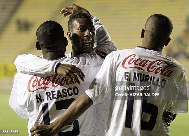 Neiser Reasco es felicitado por sus companeros Edison Mendez y Elkin Murillo de la Liga Deportiva de Quito despues de marcar el primer gol contra The...