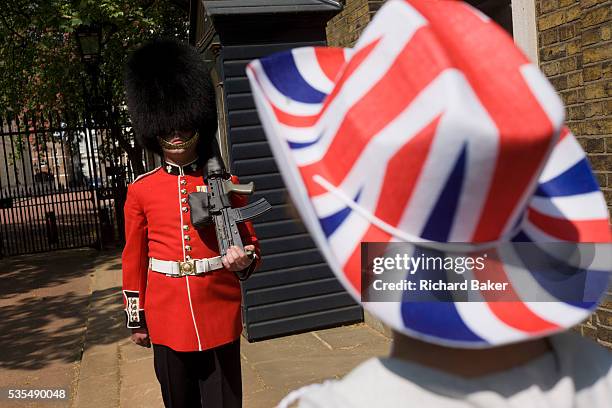 Hours before the royal marriage of Prince William and Kate Middleton, a guardsman stands by his sentry box in front of Clarence House in St James...