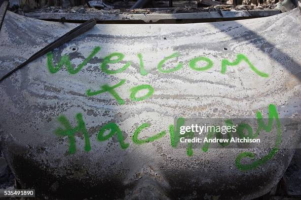 Hackney Riot Bus Welcome to Hackney graffiti on a burnt out car along Clarence road ...