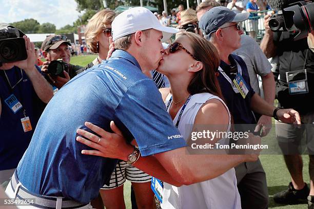 Jordan Spieth kisses his girlfriend, Annie Verret, after winning the DEAN & DELUCA Invitational at Colonial Country Club on May 29, 2016 in Fort...