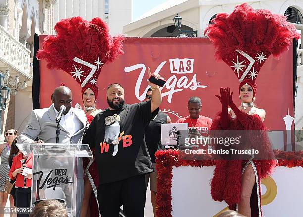 Councilman Ricki Barlow, DJ Khaled, Las Vegas showgirls Jennifer Aurty and Porsha Revesz during the ceremony presenting DJ Khaled a key to the Las...