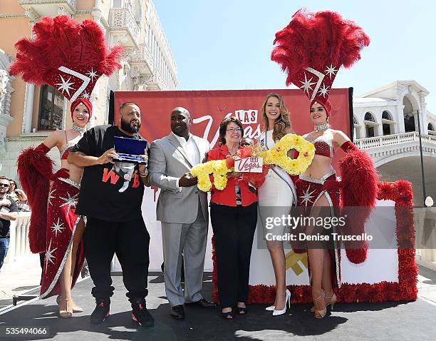 Las Vegas showgirls Jennifer Aurty, Porsha Revesz, councilman Ricki Barlow commissioner Mary Beth Scow, Miss USA Olivia Jordan and DJ Khaled attend...