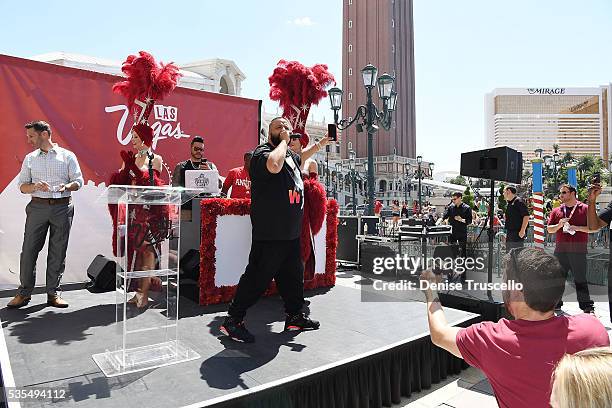 News anchor Sean McAllister, DJ Khaled, Las Vegas showgirls Jennifer Aurty and Porsha Revesz during the ceremony presenting DJ Khaled a key to the...