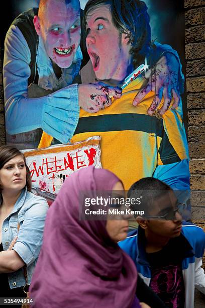 Tourists queue up outside the London Dungeons at London Bridge. The London Dungeon is a popular London tourist attraction,[1] which recreates various...