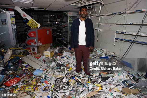 After the riots of London and other UK cities, Sri Lankan-born Sivaharan Kandiah expresses shock in his looted shop 'Clarence Convenience Store' in...