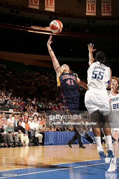 Tully Bevilaqua of the Indiana Fever shoots against Vickie Johnson of the New York Liberty in Game One of the Eastern Conference Semis during the...