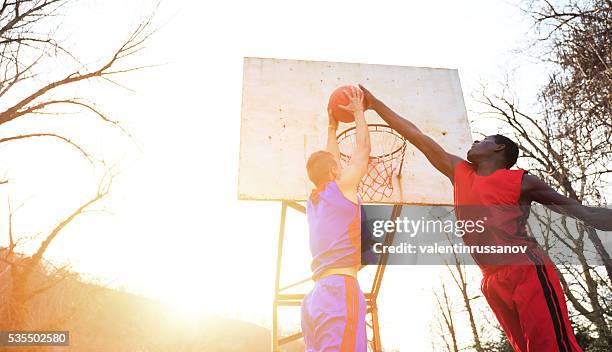 street basketball players - basketball blocking shot stock pictures, royalty-free photos & images