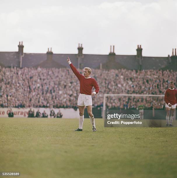 Scottish footballer Denis Law plays a game for Manchester United soon after signing for the club for a record transfer fee in 1962.