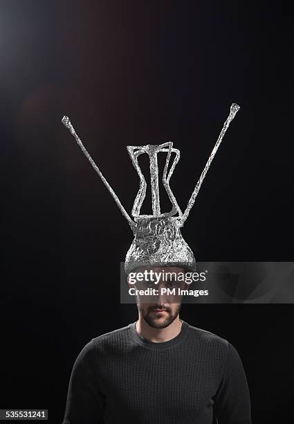 man wearing antenna hat - foil stock pictures, royalty-free photos & images