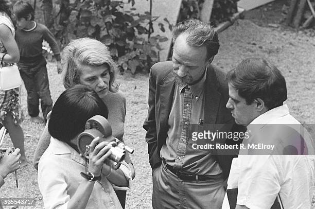 Elevated view of, from left, French filmmaker Agnes Varda , film critic Annette Michelson, filmmaker Ed Emshwiller , and an unidentified figure as...