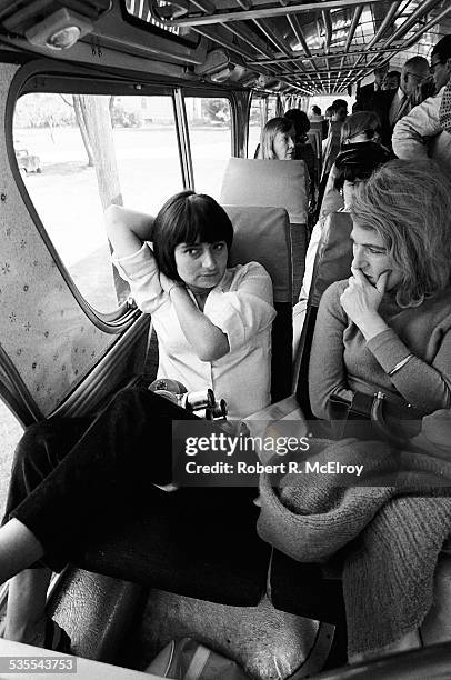 On a bus on their way home from a visit to Stan Vanderbeek's studio and 'Movie Drome' theatre as part of the New York Film Festival, French film...