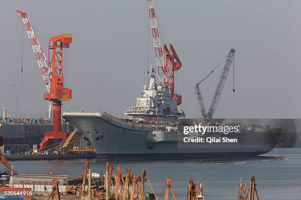 The Russian built aircraft carrier Varyag is seen docked in Dalian, Liaonin Province, China on 23 April 2011. Bought from Ukrain at an auction under...