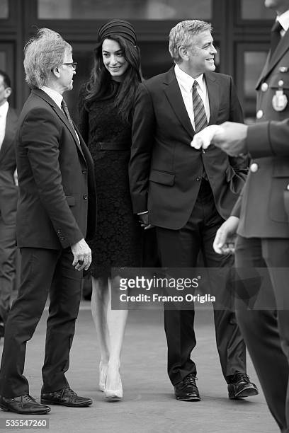 George Clooney and Amal Clooney leave at the end of 'Un Muro o Un Ponte' Seminary held by Pope Francis at the Paul VI Hall on May 29, 2016 in Vatican...