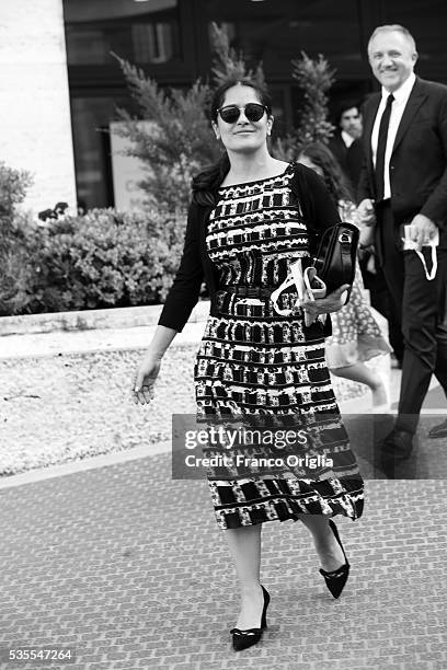 Salma Hayek, Francois-Henri Pinault leave at the end of 'Un Muro o Un Ponte' Seminary held by Pope Francis at the Paul VI Hall on May 29, 2016 in...