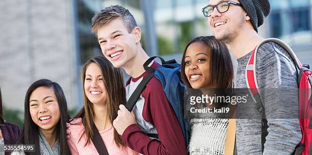 group of students standing in a row outdoors - high school building exterior stock pictures, royalty-free photos & images
