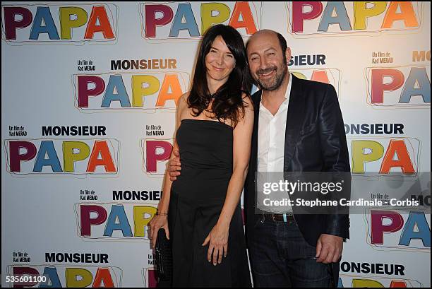 Kad Merad with his Wife Emmanuelle Cosso attend the premiere of "Monsieur Papa", in Paris.