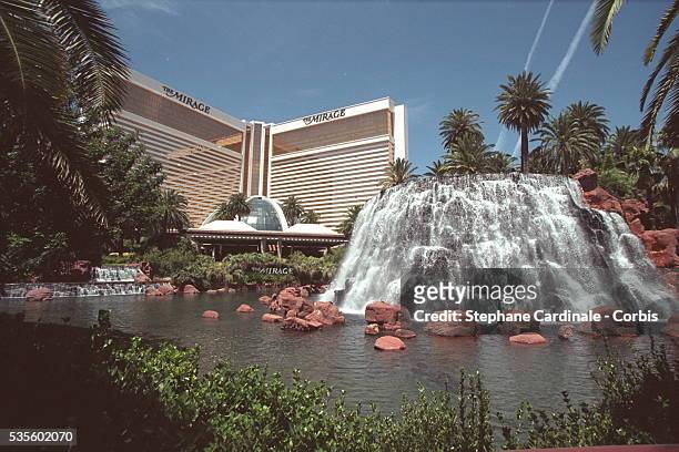 The Mirage Hotel and its artificial waterfall, behind it is a volcano that erupts at night.