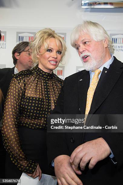 Actress Pamela Anderson and environmental activist Paul Watson give a press conference after attending a session of questions to the Government at...