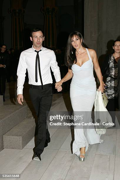 Alexis Roche and Italian actress Monica Bellucci at the Christian Dior fashion show during Paris Fashion Week.