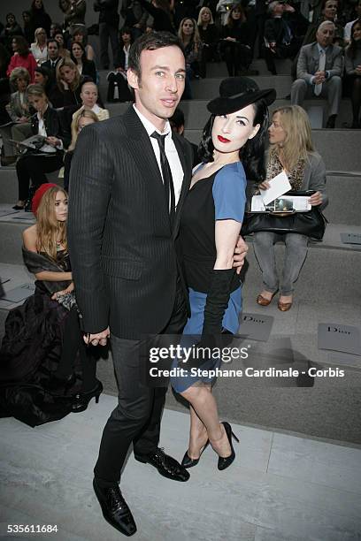 Alexis Roche and American stripper, dancer and model Dita von Teese at the Christian Dior fashion show during Paris Fashion Week.