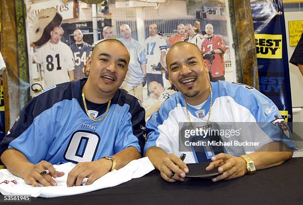 Musicians Sergio Gomez and Francisco Gomez of AWKID sign copies of their new album, "Los Aguacates de Jiquilpan" at Best Buy on August 30, 2005 in...