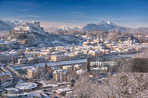 salzburg with hohensalzburg covered in snow - salzburg stock pictures, royalty-free photos & images