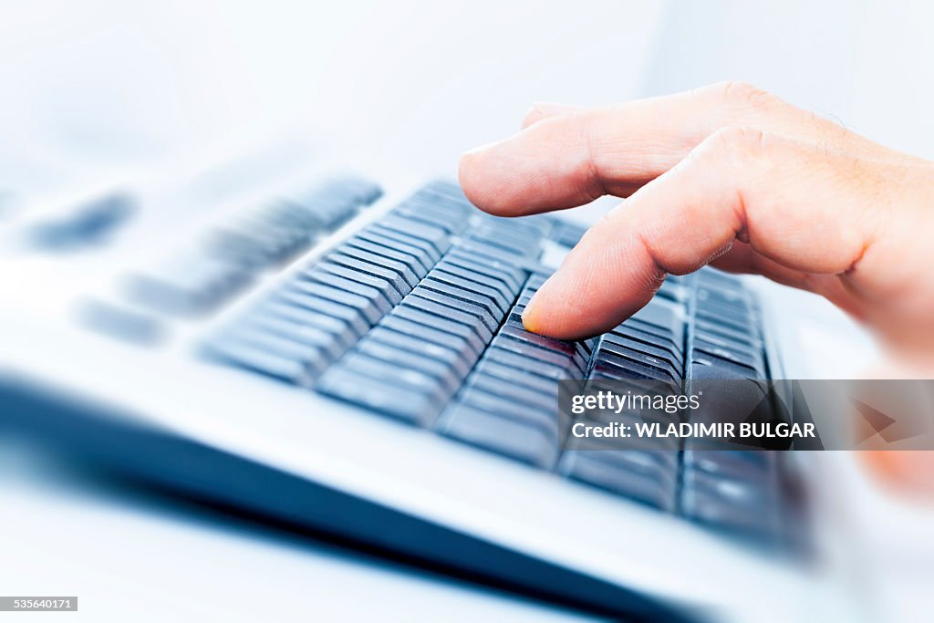 Person using a computer keyboard