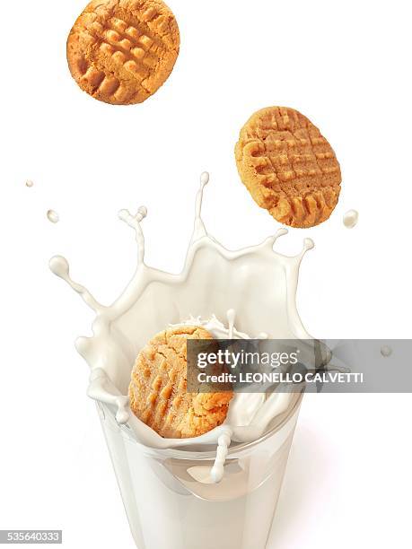 biscuits splashing into milk, artwork - cookie stock illustrations