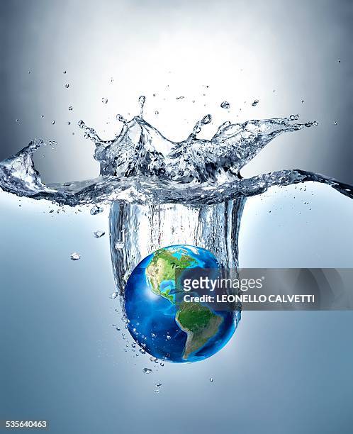 planet earth splashing into water - water globe stock illustrations