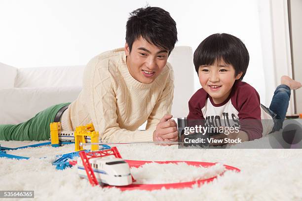 father and son - radio controlled handset stock pictures, royalty-free photos & images