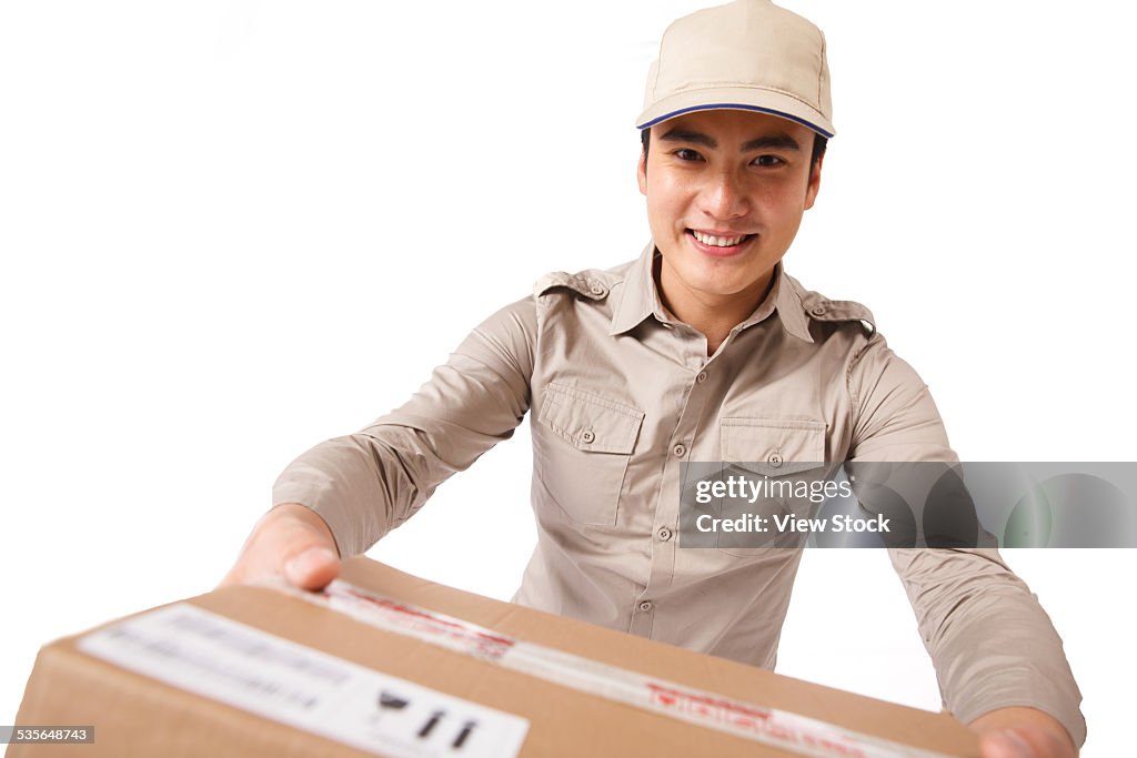 Young man delivering box