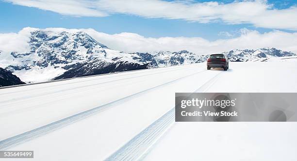 road covered with the snow - mountain road stock pictures, royalty-free photos & images