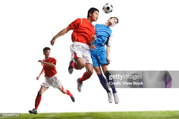 close-up of soccer players - ヘディングをする ストックフォトと画像