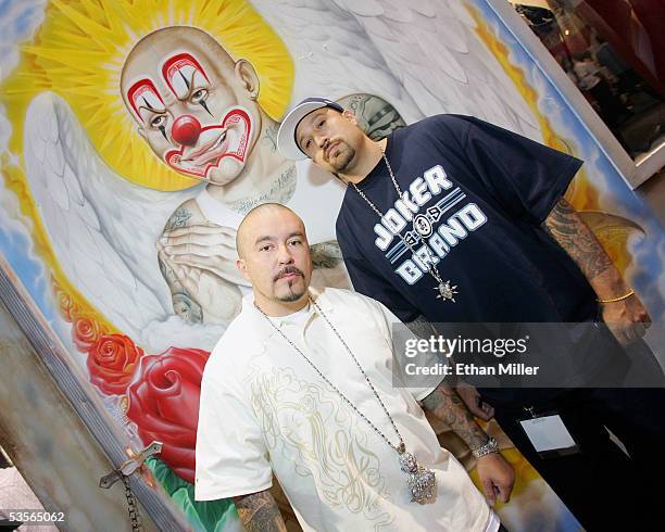 Joker Brand owner "Mr. Cartoon" and rapper B-Real, of Cypress Hill, pose at the Joker Brand clothing booth at the MAGIC convention at the Las Vegas...