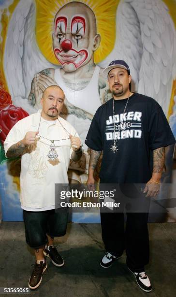 Joker Brand owner "Mr. Cartoon" and rapper B-Real, of Cypress Hill, pose at the Joker Brand clothing booth at the MAGIC convention at the Las Vegas...