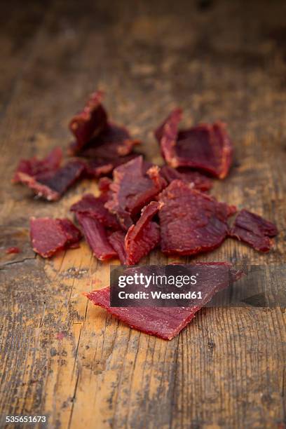 beef jerky on wood - beef jerky stock pictures, royalty-free photos & images